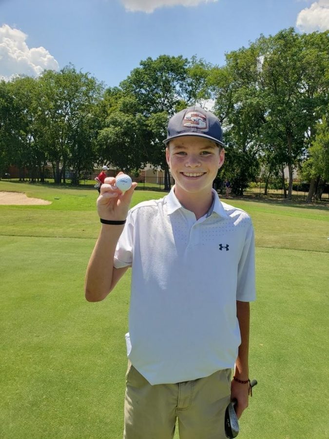 Sophomore+Camden+Rafferty+shows+off+the+ball+he+used+to+hit+his+hole-in-one.