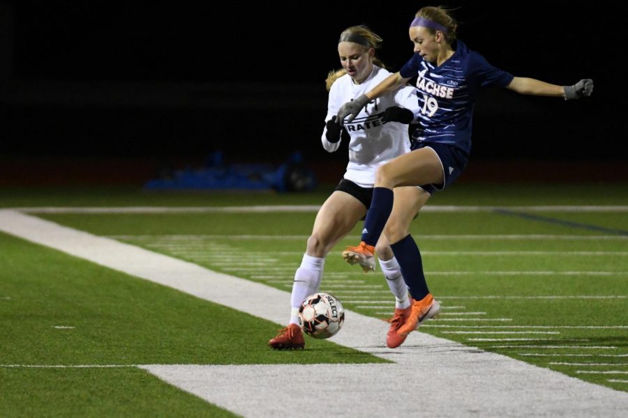 Junior Chayse Thorn fights for possession in the first game against Wylie.