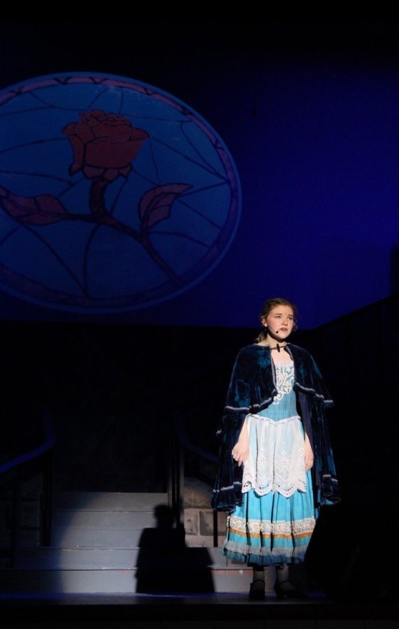 Senior Kaitlyn Collins sings during last years production of Beauty and the Beast.