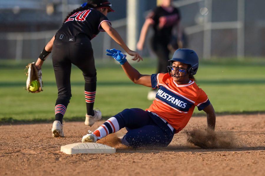 Sophomore Malani Hill slides into second base.  Hill had one stolen base in the game.